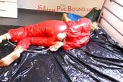 Sophie ties and gagges herself on bed wearing a beautiful red PVC sauna suit (Pics)