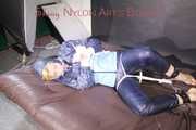 PIA tied with ropes on the sofa, gagged with a cloth gag wearing a sexy blue oldschool shiny nylon rain suit (Pics)