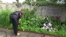 Watching sexy Sandra wearing sexy shiny nylon rainwear gardening outside (Video)