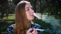 Sweet Svetlana is smoking two all white cigarettes