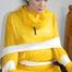 Jill tied and gagged on a chair wearing a yellow rainsuit and coveres with an yellow raincoat with two hoods (Pics)