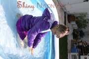 Watching sexy Mara wearing a sexy purple downskirt and a purple downjacket lolling in the swimming pool (Pics)