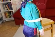 Mara tied and gagged and hooded on a chair wearing sexy shiny nylon shorts over a rainpants and a rain jacket (Pics)