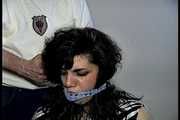 35 YEAR OLD ITALIAN HAIRDRESSER IS CLEAVE GAGGED, MOUTH STUFFED WITH PANTIES, HANDGAGGED, WHILE TIGHTLY TIED TO A CHAIR (D74-14)