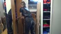 Watching sexy Sandra wearing a black shiny nylon jumpsuit doing her housework (Video)