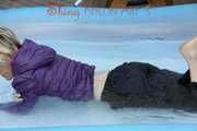 Watching sexy Sonja wearing a supersexy black rain pants and a purple down jacket taking a bath in the swimming pool (Pics)