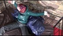 Mara tied and gagged on a princess bed in an old cellar wearing an supersexy shiny green down jacket and a rain pants (Video)