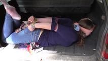 Lady X hogtied with towels 2/2
