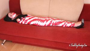 [From archive] Marvita mummified in red and white duct tape