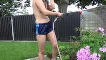 Watching Ayiana wearing  only a sexy blue shiny nylon shorts watering the flowers (Video)