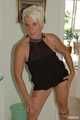 Blonde mature Claudia stipping out of a black dress