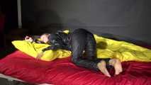 Sexy Sandra wearing sexy shiny nylon rainwear lolling in bed (Video)