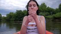 Lera is sailing on the air boat and smoking