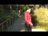 Enni taking a walk while wearing a sexy red down jacket and a shorts beneath the jeans (Video)