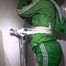 Sonja tied and gagged in a shower with tape and rope wearing a supersexy green shiny nylon shorts and rain jacket (Video)