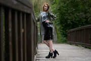 Miss Petra in a hot vinyl skirt, high heels and transparent blouse at photo shooting