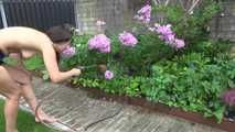 Watching Ayiana wearing  only a sexy blue shiny nylon shorts watering the flowers (Video)