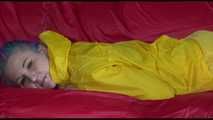 Watching Mara putting on sexy yellow shiny nylon rainwear lolling on the sofa (Video)