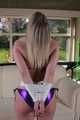 Sophie bound and gagged in a purple shiny wetlook Bikini