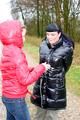 Beautiful archive girl tied and gagged outdoor by another one both wearing a shiny downjacket (Pics)