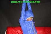 Sexy Sonja being tied and gagged overhead wearing a sexy shiny nylon rainwear combination (Pics)