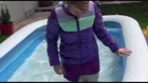 Watching Mara wearing a sexy short down skirt and a down jacket playing with water in the swimming pool (Video)