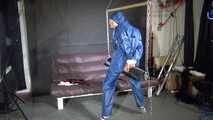 Watch Sandra bound gagged and wearing her shiny nylon Rainwear