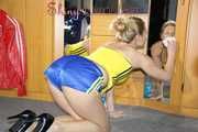 ***NEW MODEL*** Sandra wearing highheels and a sexy blue/yellow shiny nylon shorts and a yellow top during cleaning the mirror (Pics)