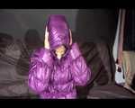 Sexy SANDRA wearing a shiny black rain pants and a purple down jacket with totally closed hood lolling on a sofa (Video)