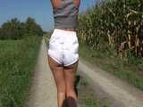 Watch Chloe taking a walk with her shiny nylon Shorts