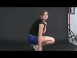 Archive girl posing with a soccer ball wearing a sexy blue shiny nylon shorts and a top (Video)