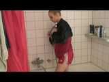 SEXY JENNI wearing a hot red shiny nylon shorts and an oldschool red/blue shiny nylon rain jacket while taking a shower (Video)