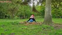 Rubber boot mistress presses slave face into manure