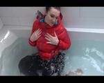 Jil wearing a sexy black down pants and a red down jacket taking a bath (Video)