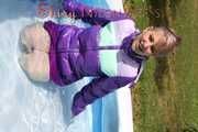 Watching sexy Mara wearing a sexy purple downskirt and a purple downjacket lolling in the swimming pool (Pics)