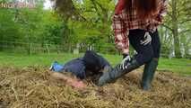 Rubber boot mistress presses slave face into manure