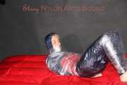 Sonja being tied, gagged and hooded with plastic wrap wearing a sexy shiny nylon rainwear combination (Pics)