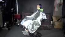 See Ronja tied and gagged on a Barber Chair in shiny nylon Rainwear and a shiny cape!