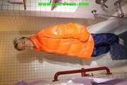 SEXY SONJA wearing a black shiny nylon rain pants and an orange big downjacket enjoying a bath (Pics)