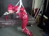 Watch Sandra beeing bound gagged and pantyhooded in her shiny nylon Rainwear