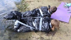 [From archive] Dana&Ketrin - Dana is packed in trashbags by Ketrin, then Ketrin packed next to Dana (video)