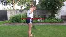 Watching sexy SANDRA wearing a darkblue/white striped  shiny nylon shorts and a top while gardening outdoor (Video)