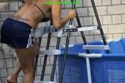 Watch Sandra cleaning the pool wearing a shiny nylon Shorts