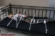 Extremly tied on the bed
