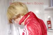 Sonja tied and gagged with cuffs and a cloth gag in a shower wearing a sexy red shiny nylon jumpsuit (Pics)