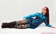 Nadja shows her short black pvc dress under a blue raincoat