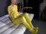 Watch Pia enjoying Bondage in her shiny nylon yellow Rainwear