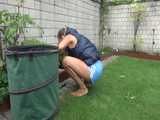 Get a video with Sandra gardening in her shiny nylon Downvest