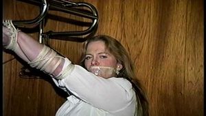 30 Yr OLD BBW SINGLE MOM IS MOUTH STUFFED, TAPE GAGGED, BAREFOOT, TIT TIED, NIPPLE PINCHED AND TIED TO A COAT RACK (D73-11)