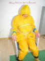 Katharina tied, gagged and hooded on a chair wearing sexy yellow rainwear (Pics)